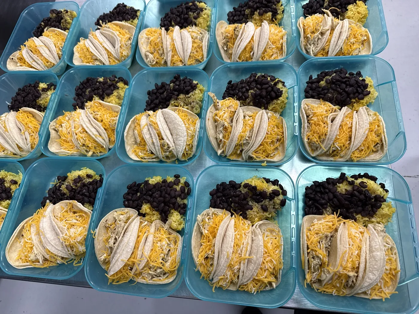 Chicken tacos with yellow rice and black beans