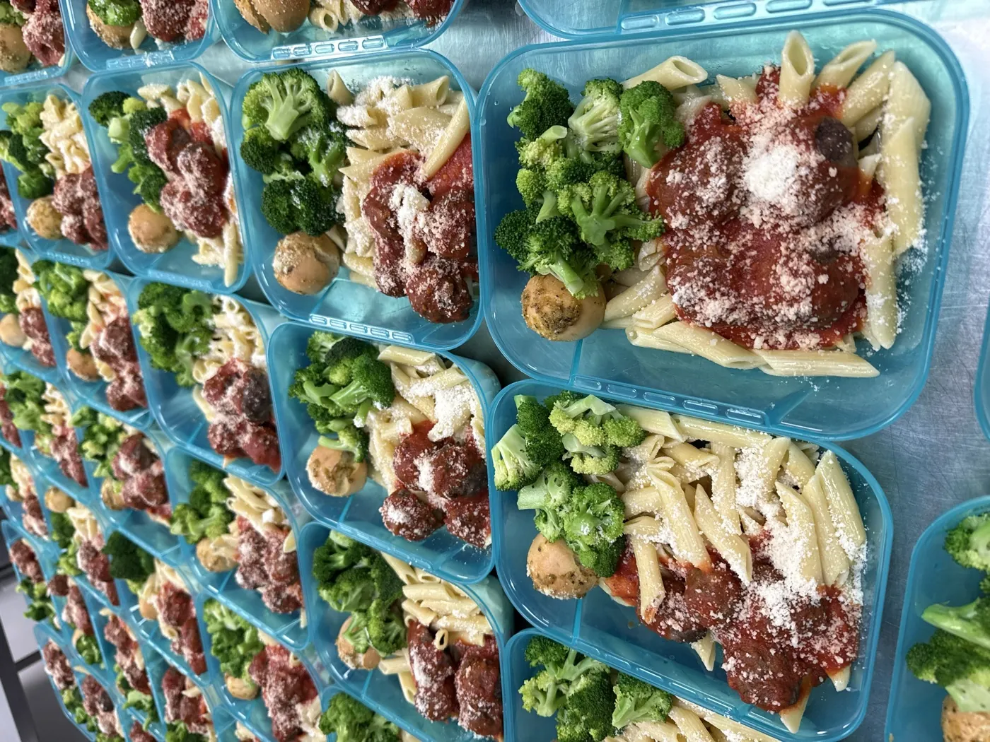 Penne marinara with meatballs and parmesan